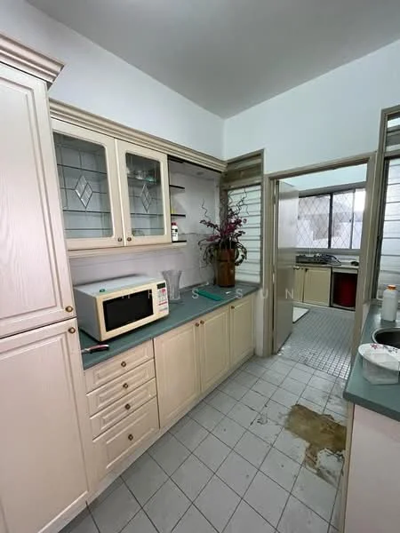 Kitchen features: cream cabinetry with glass-front upper cabinets, grey countertop, built-in microwave, double-basin stainless-steel sink, chrome faucet, tile flooring, wall-mounted shelving, decorative vase with flowers, window with metal grille, open layout to adjacent room; style: traditional.
