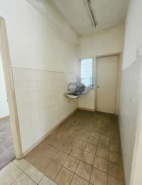 Laundry features: white tiled walls, cream tiled flooring, single-bowl stainless-steel sink, window for natural light, door leading to another room, light fixture on ceiling, neutral wall color, minimalist design.