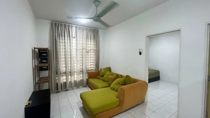 Living features: green fabric sofa with chaise, white painted walls, white tiled flooring, 5-blade ceiling fan with light, floor-to-ceiling windows with sheer curtains, wooden shelving unit, black TV console, decorative throw pillows; style: modern. Room features: white painted walls, white tiled flooring, bed visible in adjacent room.