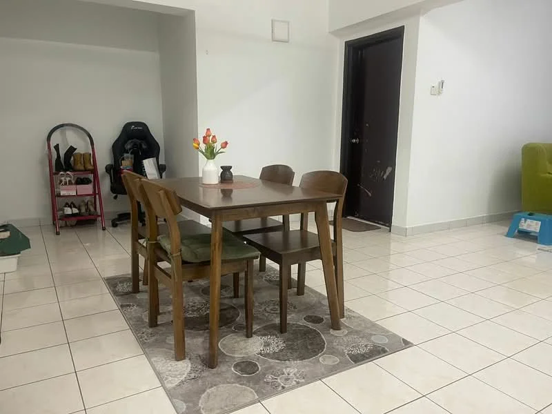 Dining features: rectangular wooden dining table, 4 wooden dining chairs, area rug with circular pattern, white painted walls, tile flooring, decorative vase with flowers, wall-mounted light switch, door leading to hallway, shoe rack with shoes, green upholstered chair, open space layout; style: modern.