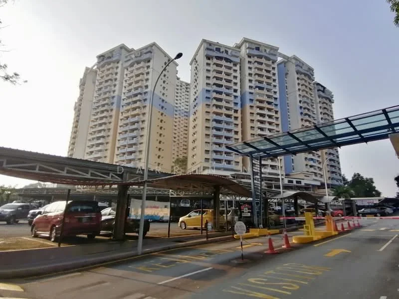Exterior type: high-rise condominium; features: multi-storey building, covered parking area, open-air parking lot, glass canopy over parking, security cones, surrounding greenery, urban context, visible balconies, varied facade colors; style: modern.