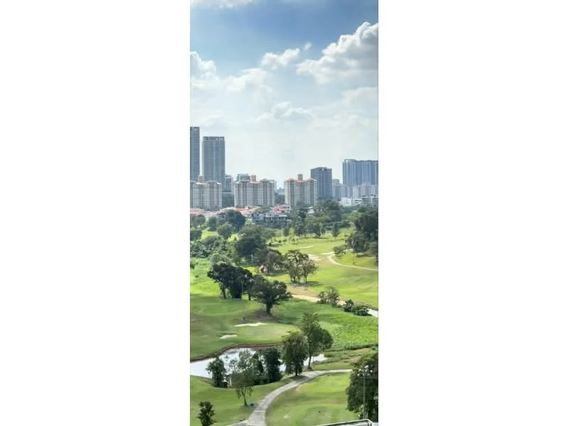 Exterior type: high-rise condominium; features: city skyline view, golf course view, lush greenery, water features, surrounding high-rise buildings, clear blue sky, clouds, well-maintained landscape; style: modern.