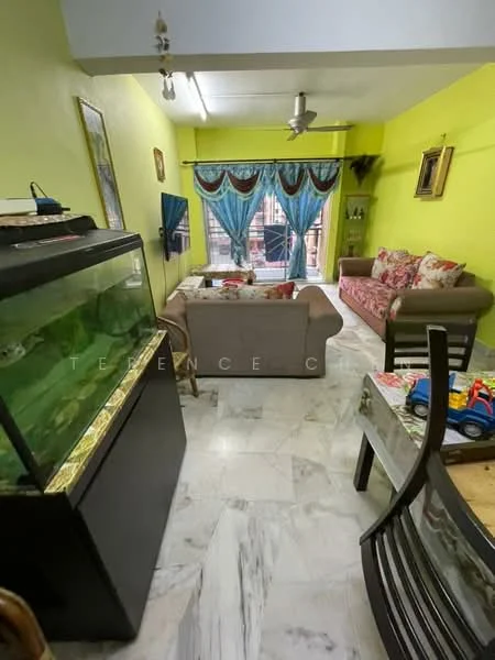 Living features: green painted walls, marble flooring, 5-blade ceiling fan, sofa with floral upholstery, 2-seater fabric sofa, coffee table, TV mounted on wall, curtains with floral pattern, aquarium, decorative wall art, dining table with chairs, toys on table; style: contemporary.