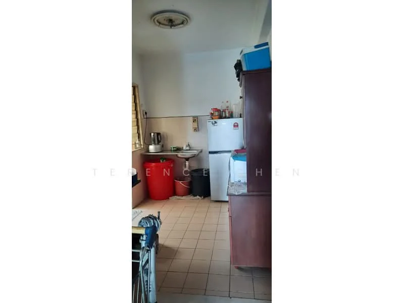 Kitchen features: white walls, tile flooring, ceiling light fixture, single-bowl stainless-steel sink, chrome pull-down faucet, white fridge, red trash bin, wood cabinetry, countertop space, kitchen appliances, kettle, open shelving.