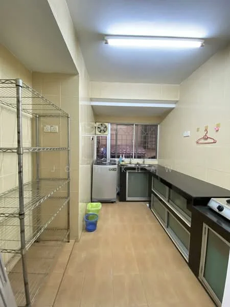 Kitchen features: white tiled walls, light brown ceramic tile flooring, stainless-steel fridge, stainless-steel gas hob, black countertop, metal shelving unit, window with metal grille, overhead fluorescent lighting, kitchen cabinetry with glass panels, green plastic bin, blue plastic bin; style: modern.