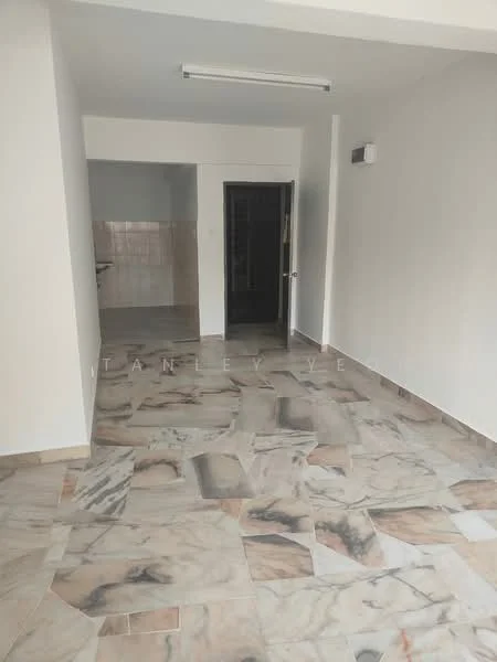 Room features: marble flooring, white painted walls, recessed ceiling lights, doorway leading to another room, kitchen area visible in the background; style: modern.