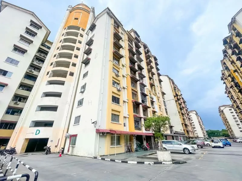 Exterior type: low-rise apartment block; features: yellow and white painted facade, multiple storeys, balconies on upper floors, parking lot with marked spaces, bicycle racks, surrounding greenery, entrance with awning, visible air conditioning units, open-air parking area; style: modern.