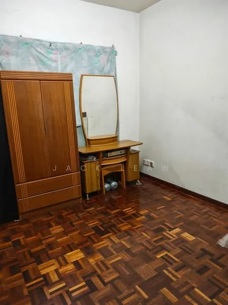 Room features: wooden flooring, painted walls in white, wooden wardrobe, wooden dressing table with mirror, decorative curtain, two bottles on the floor.
