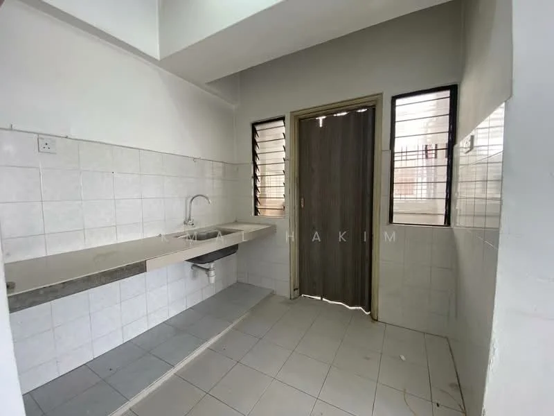 Kitchen features: single-bowl stainless-steel sink, chrome faucet, grey countertop, white tiled walls, white tiled flooring, window with metal grilles, wooden door, open layout.