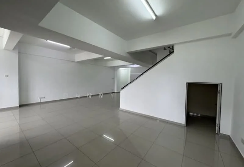 Room features: white painted walls, grey tiled flooring, exposed ceiling with fluorescent lights, staircase leading to upper level, open layout, corner nook, large windows for natural light, no visible furniture; style: modern.