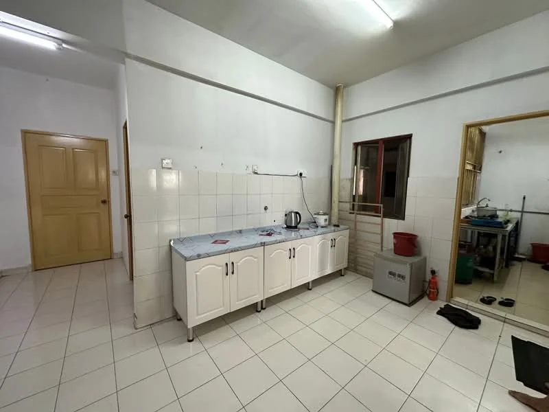 Kitchen features: white cabinetry with handles, grey marble countertop, single-bowl stainless-steel sink, chrome faucet, wall-mounted electrical outlets, tile backsplash, white tiled walls, white tiled flooring, fluorescent ceiling lights. Room features: doorway leading to another room, light-colored walls, tile flooring.
