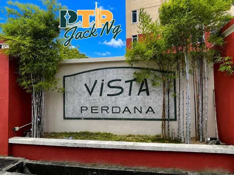 Exterior features: stone sign with engraved text, red painted wall, bamboo plants, landscaped area, clear blue sky; style: modern.
