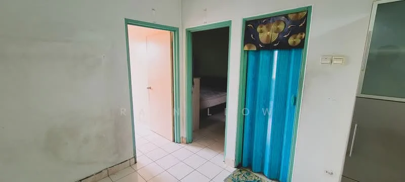 Room features: white painted walls, light green door frames, tiled flooring, blue curtain, two doorways, visible bedroom area through doorway, plain ceiling.