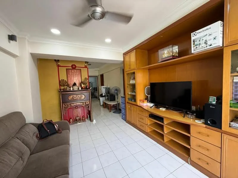 Living features: 3-seater fabric sofa in brown, wall-mounted TV, wooden TV console, built-in shelving unit, white tiled flooring, ceiling fan, recessed downlights, decorative wall with gold accents, decorative altar, open layout to adjacent room; style: modern.