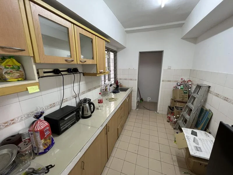 Kitchen features: light wood cabinetry, white countertop, stainless-steel kettle, black coffee machine, single-bowl stainless-steel sink, chrome faucet, tile backsplash, ceramic tile flooring, window with metal grille, various kitchen appliances, stacked boxes, plastic bags, bottled drinks.