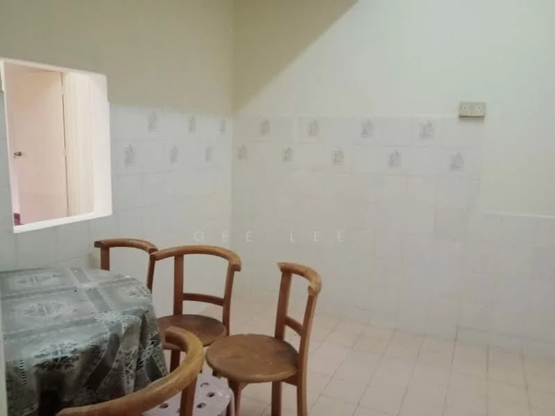 Room features: white tiled walls, light pink tiled flooring, wooden dining table, four wooden chairs, wall-mounted electrical outlet, open doorway leading to another room.