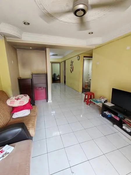Living features: brown striped fabric sofa, red plastic stool, wall-mounted TV, white tiled flooring, yellow painted walls, ceiling with decorative plaster, recessed lighting, open layout to hallway, side table with magazines; style: modern. Room features: white tiled flooring, yellow painted walls, open layout to kitchen, doorway leading to other rooms.