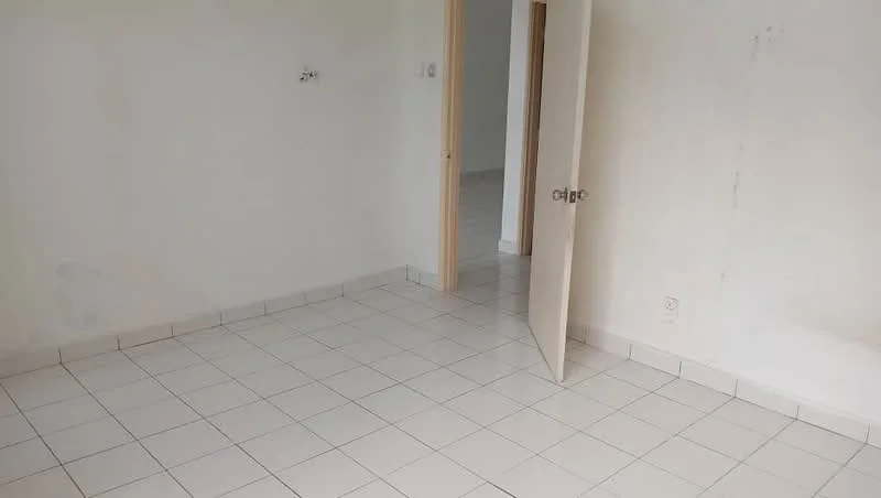 Room features: white painted walls, ceramic tile flooring, single door, neutral color scheme, no visible furniture, empty space, door leading to another room, light source from doorway; style: minimalist.