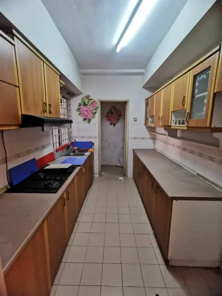 Kitchen features: brown wooden cabinetry, laminate countertop, gas stove with 4 burners, double-bowl stainless-steel sink, tile backsplash, white tiled walls, light-colored tiled flooring, window with metal grille, overhead fluorescent lighting.