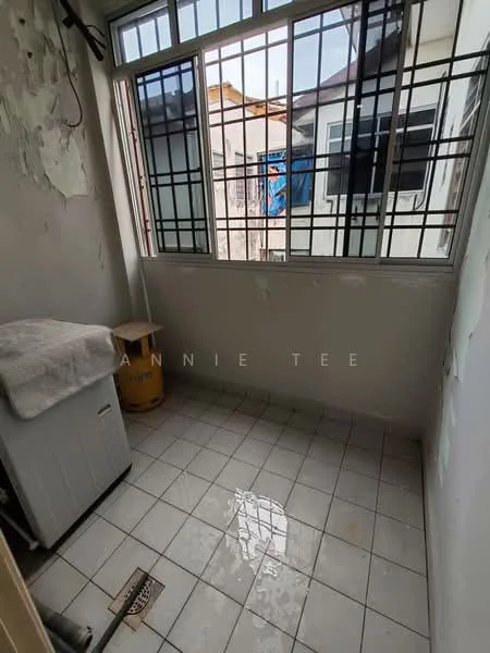 Laundry features: white tiled flooring, grey walls with peeling paint, window with metal grille, washing machine, drainage floor, natural light from window.