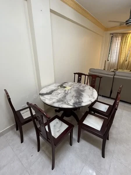 Dining features: round marble dining table, 5 wooden dining chairs with upholstered seats, white tiled flooring, cream painted walls, ceiling fan, natural light from windows; style: modern.