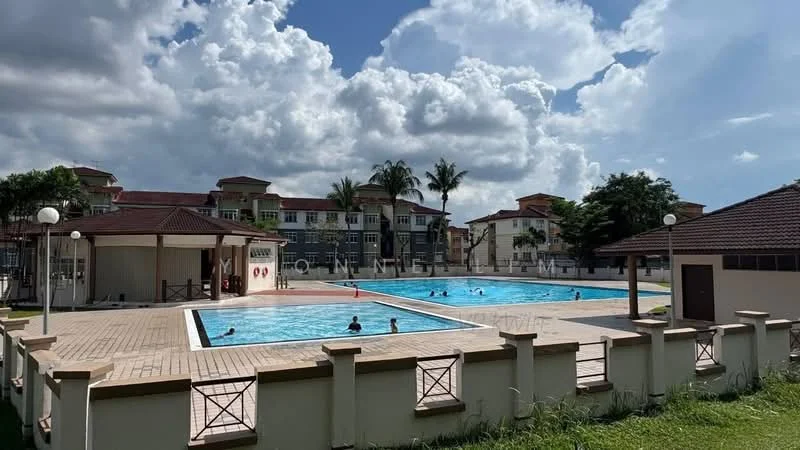 Exterior type: swimming pool deck; features: two swimming pools, pool deck with loungers, surrounding grass area, landscaped garden, palm trees, covered pavilion, residential buildings in background, clear blue sky, partly cloudy, fenced perimeter; style: modern.