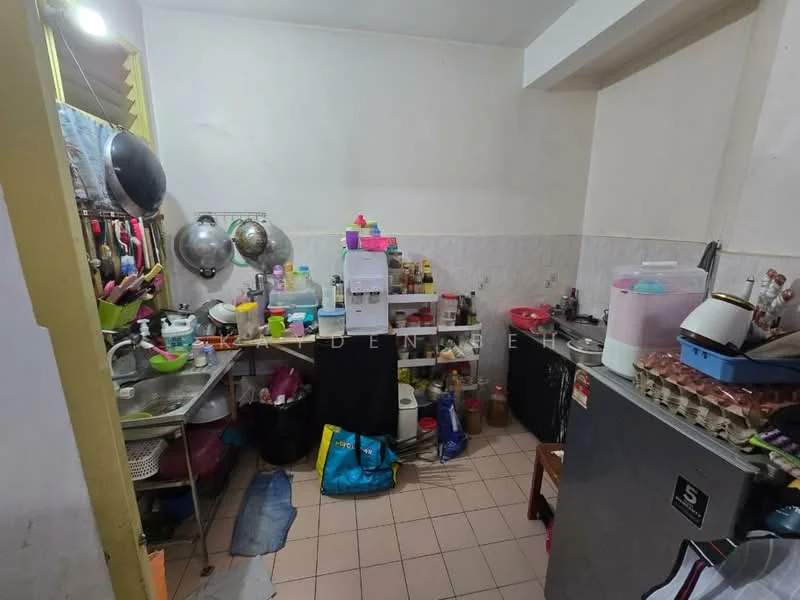 Kitchen features: stainless-steel sink, chrome pull-down faucet, white tiled backsplash, black countertop, built-in cabinets, open shelving, multiple containers and jars, kettle, toaster, microwave, egg tray, floor tiles in beige, wall-mounted storage, various kitchen appliances.