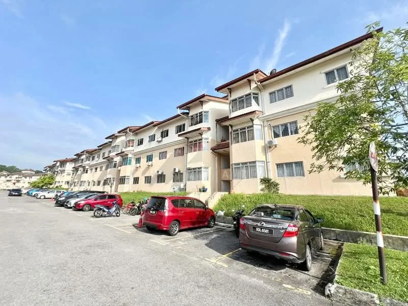Exterior type: low-rise apartment block; features: white painted facade, red tiled roof, multiple balconies, ground floor parking area, manicured lawn, surrounding greenery, multiple vehicle parking spaces; style: modern.