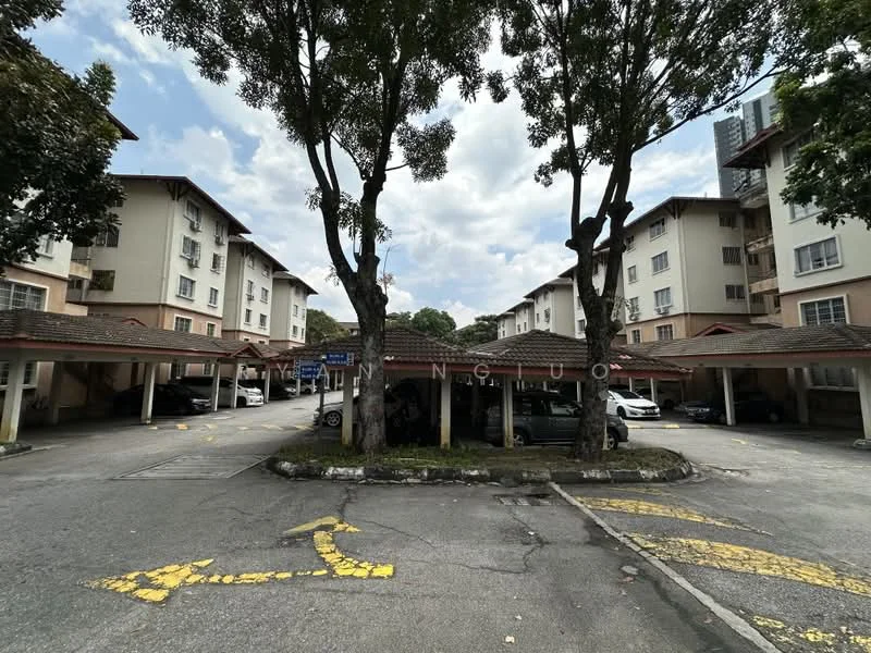 Exterior type: low-rise apartment block; features: two-storey building, covered car porch, manicured landscaping, mature trees, asphalt driveway, parking spaces, signage visible, cloudy sky; style: modern.