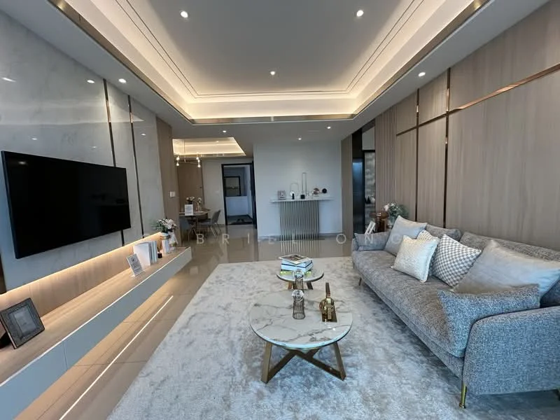 Living features: grey fabric sofa, marble coffee table, area rug with geometric pattern, wall-mounted TV, built-in shelving unit, recessed LED downlights, crown moulding, light wood paneling, large windows, decorative plants in ceramic pots; style: modern.