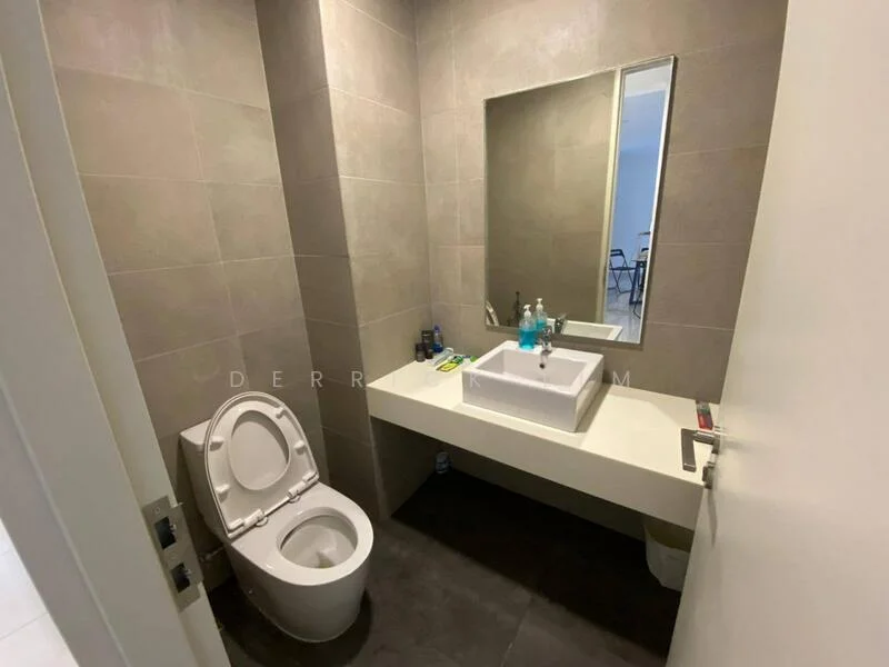 Bathroom features: grey tiled walls, white sink with countertop, large mirror, one-piece toilet, dark tiled flooring, wall-mounted faucet, toiletries on countertop, minimalist design; style: modern.
