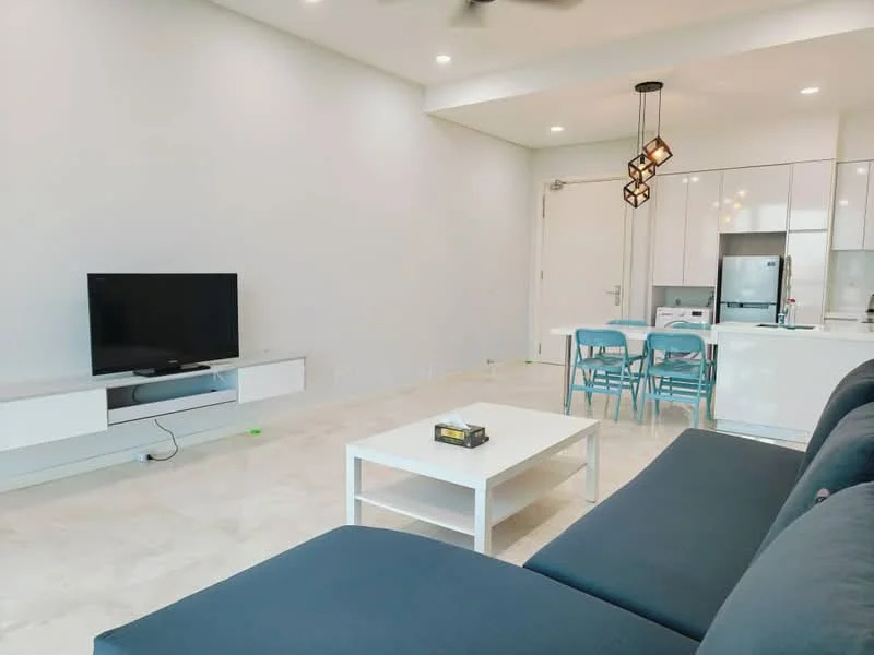 Living features: grey fabric sofa, white coffee table, TV console, wall-mounted TV, pendant light fixture, marble flooring, white painted walls, open-plan layout with kitchen, dining area with blue chairs, refrigerator visible in background, kitchen cabinetry, ceiling fan; style: modern.