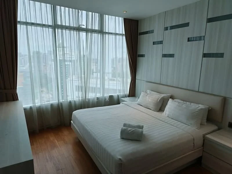 Bedroom features: king-size bed with white bedding, upholstered headboard, floor-to-ceiling windows, sheer curtains, wooden flooring, built-in wardrobe, decorative wall panels, nightstand with lamp; style: modern; view: city.