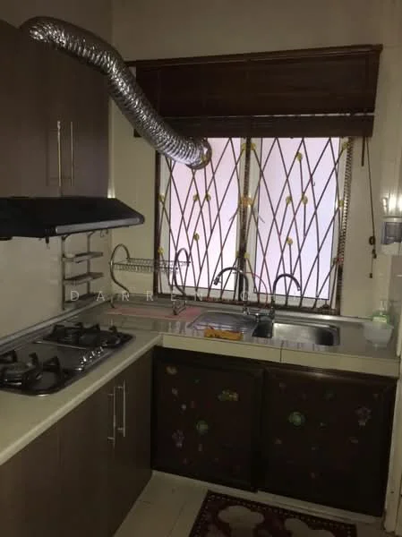Kitchen features: brown cabinetry with floral design, stainless-steel sink, chrome faucet, 4-burner gas hob, exhaust hood, window with security bars, roller blinds, wall-mounted dish rack, countertop space, tile backsplash.