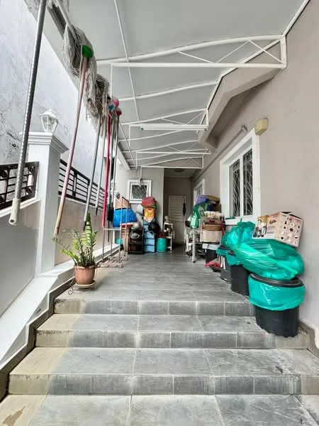 Exterior features: covered walkway, grey tiled flooring, white painted walls, metal roof structure, green garbage bins, plastic storage containers, potted plant, cleaning tools hanging, steps leading up, side wall with railing; style: modern.