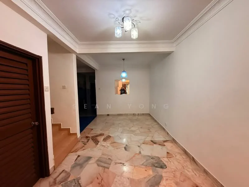 Room features: marble flooring, white painted walls, crown moulding, recessed ceiling lights, pendant light fixture, staircase visible in background, open layout, doorway leading to another room; style: modern.