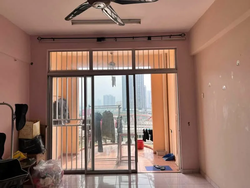 Living features: pink painted walls, glazed tile flooring, 5-blade ceiling fan, sliding glass door, floor-to-ceiling windows, curtain rod, balcony view, clothes hanging on railing, decorative light fixture, wall-mounted hooks; view: city. Room features: cluttered space, items on the floor.