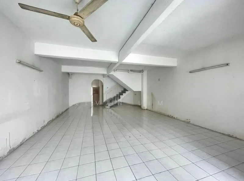 Room features: white painted walls, grey tiled flooring, exposed ceiling with beams, ceiling fan, staircase leading to upper level, two wall-mounted light fixtures, open layout, large open space; style: minimalist.
