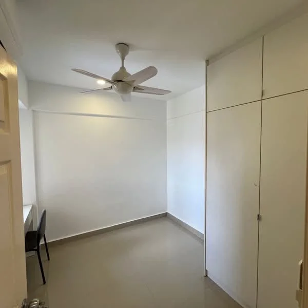 Room features: white painted walls, light grey floor tiles, 5-blade ceiling fan, built-in wardrobe with sliding doors, desk with chair, recessed lighting; style: modern.
