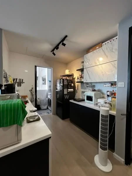 Kitchen features: white marble countertop, black cabinetry, built-in microwave, stainless-steel fridge, ceramic cooktop, kitchen sink, open shelving, recessed downlights, floor-to-ceiling cabinets, sliding door to bathroom, wooden flooring, standing fan; style: modern.
