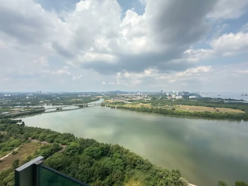 Exterior features: river view, city skyline in background, lush greenery, cloudy sky, waterfront landscape.