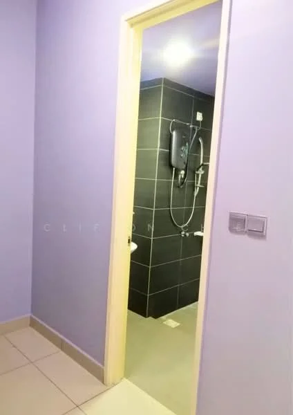 Bathroom features: purple painted walls, grey tiled walls, ceramic tile flooring, shower area with handheld shower, toilet, light fixture, door frame, wall-mounted water heater; style: modern.