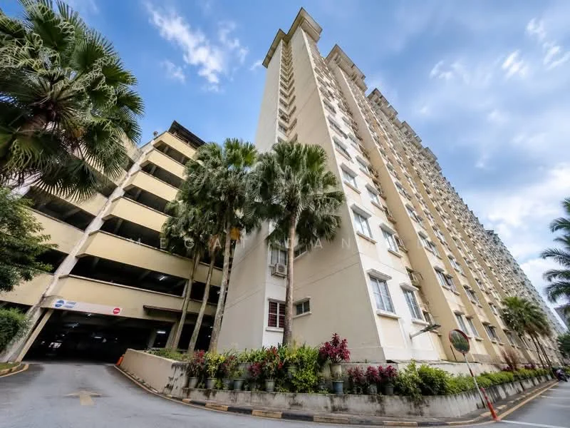 Exterior type: mid-rise condominium; features: cream painted facade, balconies on upper floors, multiple floors, landscaped garden with palm trees, parking deck visible, flower beds with shrubs, windows with white frames, entrance with signage, surrounded by greenery; style: modern.
