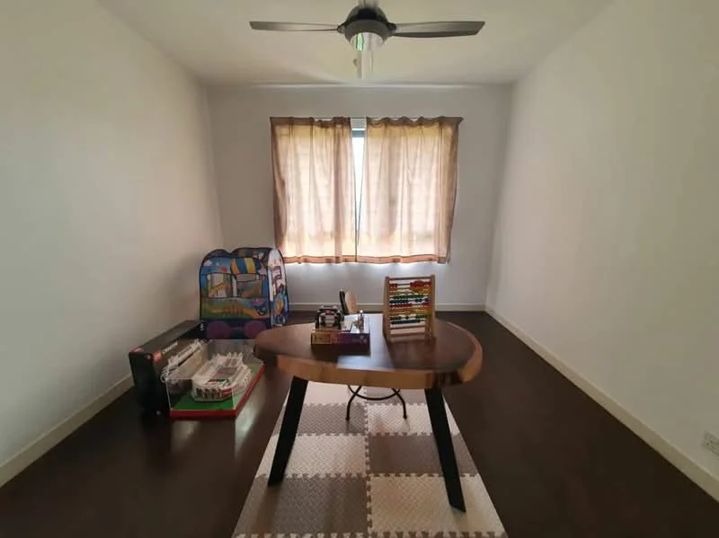 Study features: wooden flooring, white painted walls, ceiling fan with light, large window with sheer curtains, decorative area rug, wooden desk, bookshelf, children's play area with toys; style: modern.