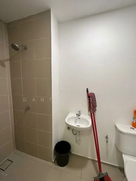 Bathroom features: shower with wall-mounted shower head, white ceramic sink, chrome basin mixer faucet, one-piece toilet, grey tiled walls, light grey floor tiles, waste bin, cleaning mop, white painted walls; style: modern.