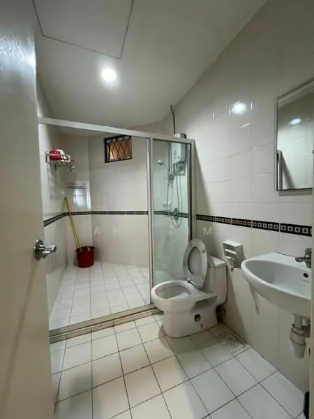 Bathroom features: white tiled walls, white tiled flooring, glass shower enclosure, rain shower head, handheld shower, one-piece toilet, sink with chrome basin mixer, framed mirror, window with security bars, cleaning supplies visible; style: modern.
