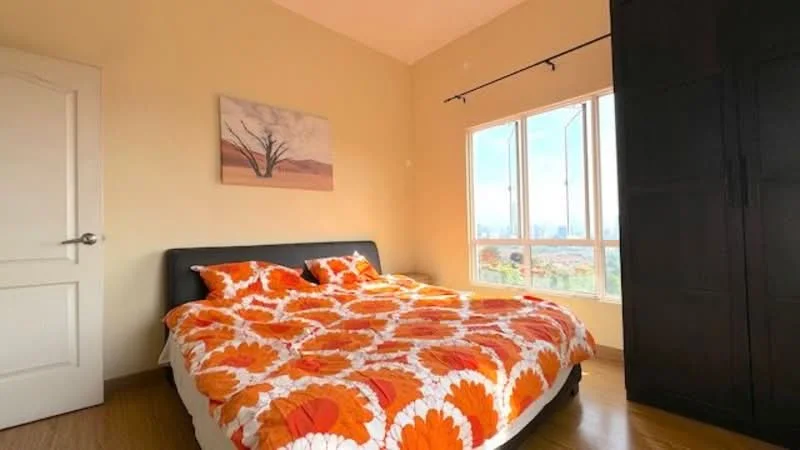 Bedroom features: queen-size bed with floral duvet cover, black upholstered headboard, wooden flooring, large window with city view, black wardrobe, decorative wall art, sheer curtains, light-colored painted walls; style: modern; view: city.