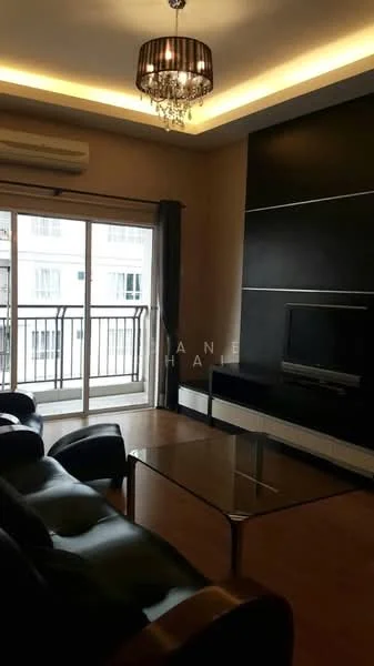 Living features: black leather sofa, glass coffee table, wall-mounted TV, black feature wall, recessed ceiling lights, chandelier, floor-to-ceiling sliding glass door, curtains, wooden flooring, air conditioning unit; style: modern; view: city.