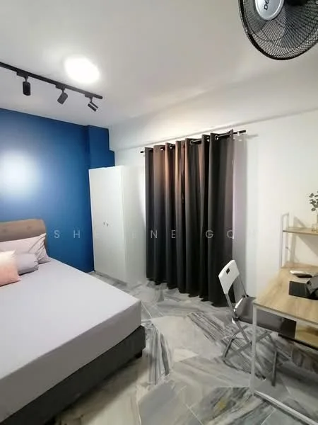Bedroom features: queen-size bed, upholstered headboard, grey bedding, white walls, blue accent wall, marble tile flooring, ceiling fan, track lighting, blackout curtains, white wardrobe, study desk, chair; style: modern.