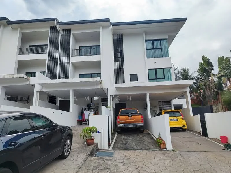 Exterior type: linked terrace house; features: three-storey building, white painted facade, black vertical fins, recessed balconies, flat roof, manicured lawn, driveway with interlocking pavers, car porch with awning, two visible parked cars, surrounded by greenery; style: modern.